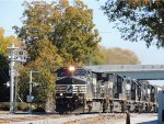 NS 9124 leading a mixed freight train under the new bridge